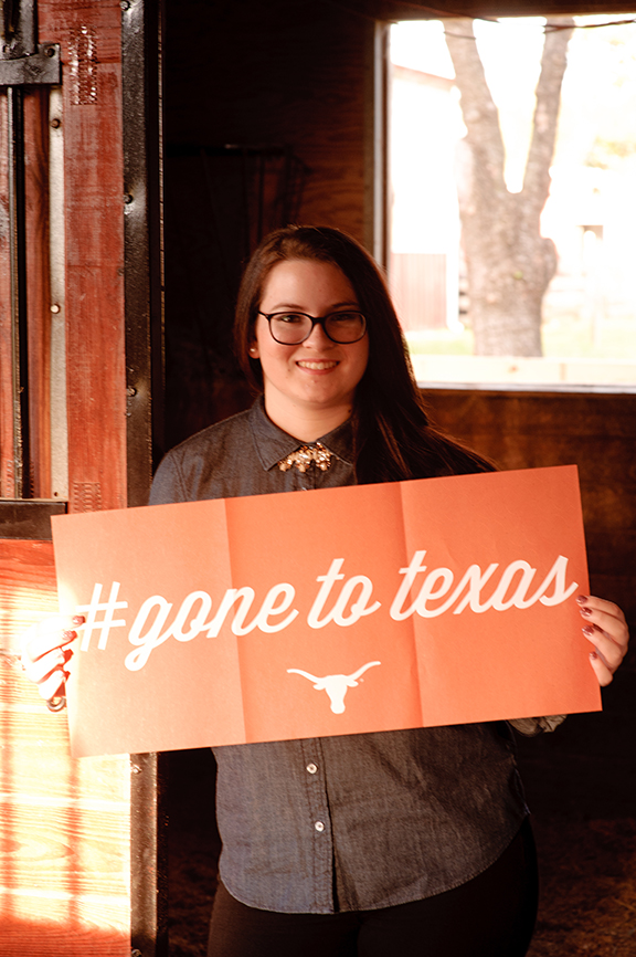 senior-portrait-holding-university-sign-ut-houston-texas